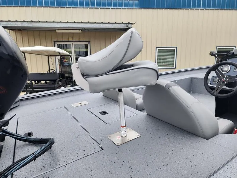 Slide: The Image of 2024 Xpress XP200 Catfish boat interior with gray seating and steering console. - 8