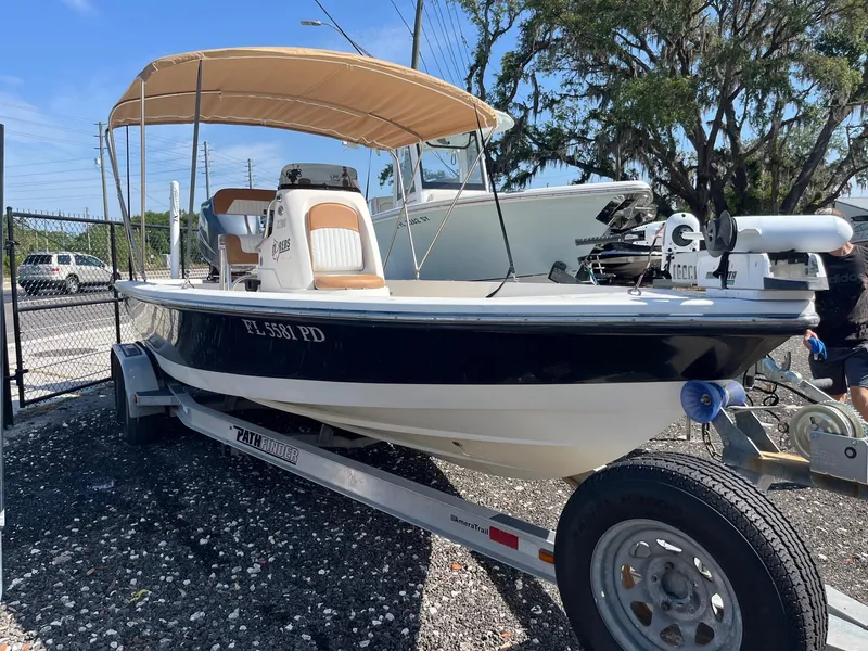 Slide: The Image of 2008 Pathfinder 2200 Tournament Edition boat on trailer with canopy, parked outdoors. - 1