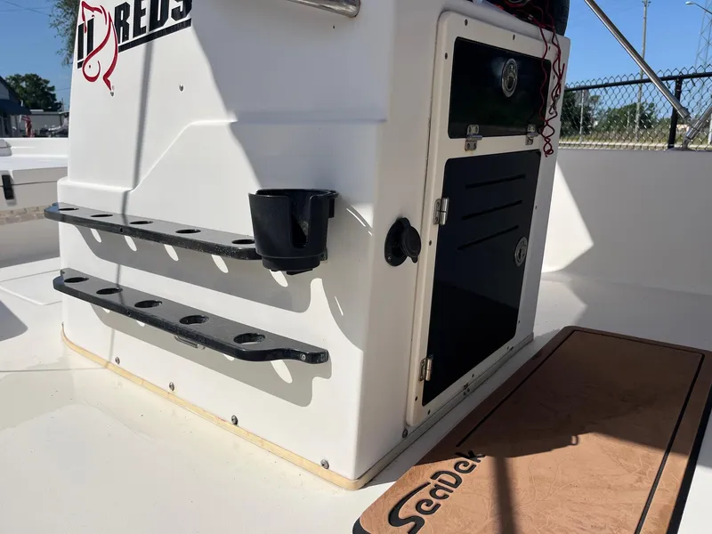 Slide: The Image of 2008 Pathfinder 2200 Tournament Edition boat interior with storage and rod holders. - 10