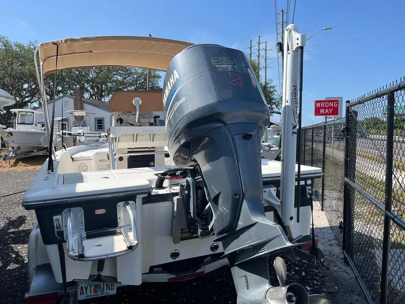 Slide: The Image of 2008 Pathfinder 2200 Tournament Edition boat with Yamaha outboard motor, parked near a "Wrong Way" sign. - 7