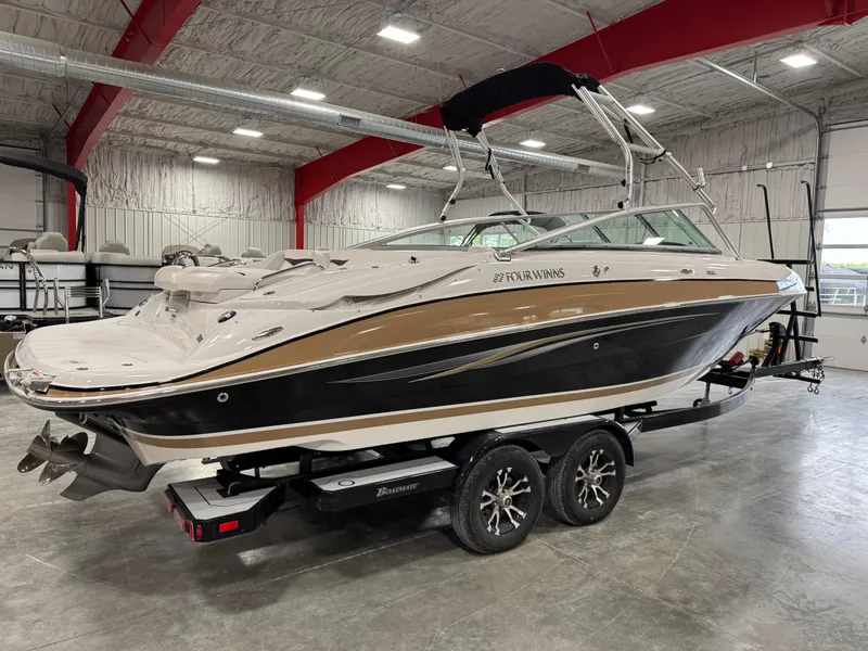 Slide: The Image of 2009 Four Winns H-260 boat on trailer in indoor storage facility. - 4