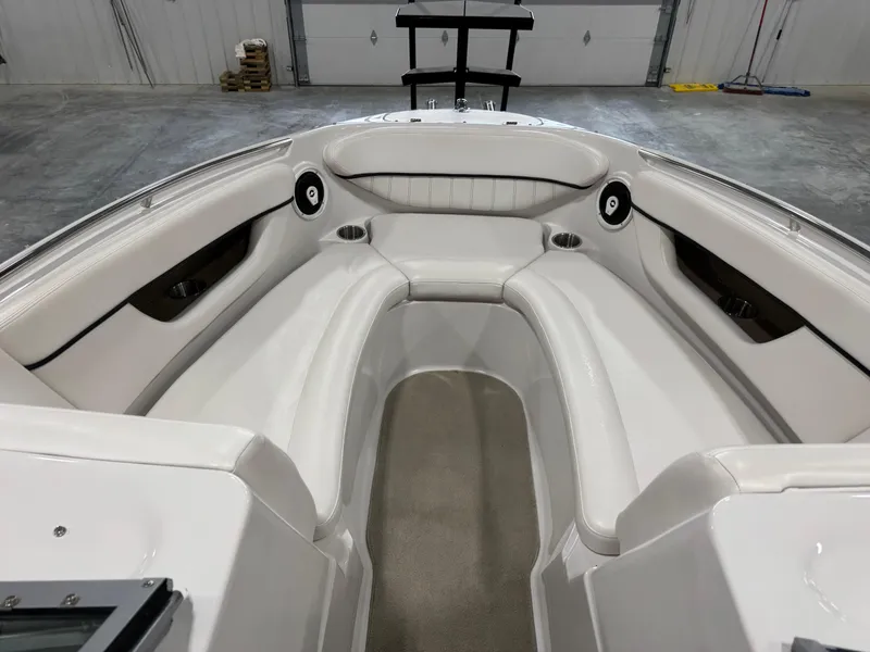 Slide: The Image of 2009 Four Winns H-260 boat interior with white seating and cup holders. - 8