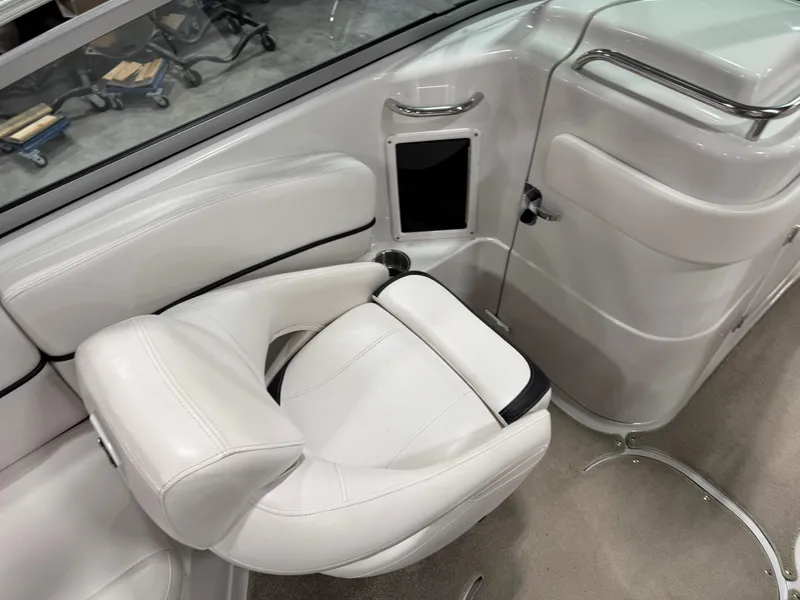 Slide: The Image of 2009 Four Winns H-260 boat interior with white seating and sleek design. - 9