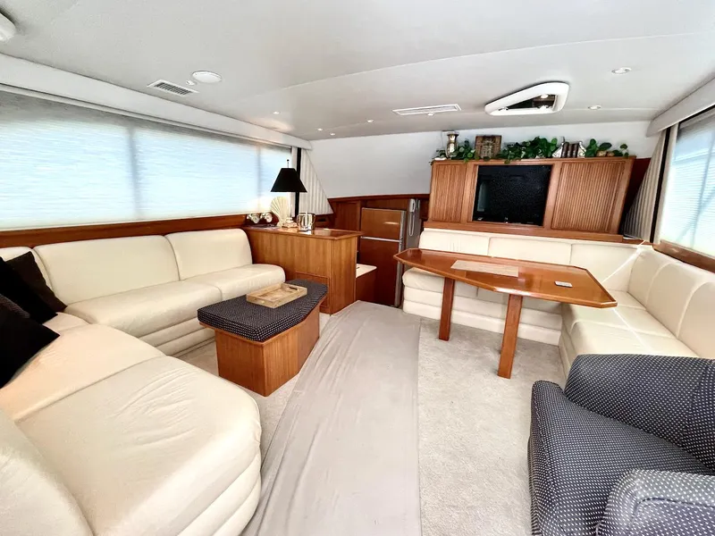 Slide: The Image of Luxurious interior of a 1997 Post 50 Convertible yacht with elegant seating and wooden accents. - 1