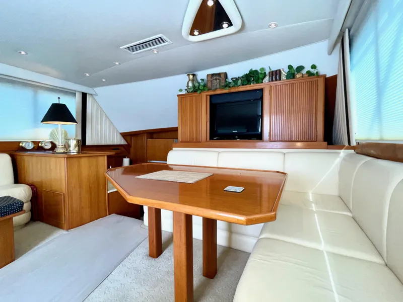 Slide: The Image of Luxurious interior of a 1997 Post 50 Convertible yacht with elegant wood and leather seating. - 12