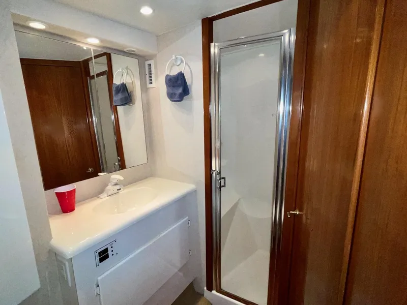 Slide: The Image of Bathroom interior of a 1997 Post 50 Convertible yacht with shower and sink. - 25