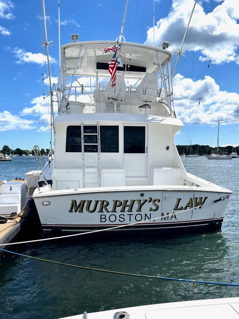 Slide: The Image of 1997 Post 50 Convertible boat named "Murphy's Law" docked in Boston, MA. - 29