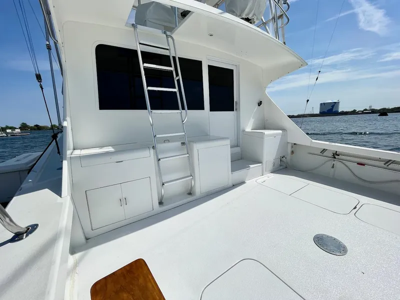 Slide: The Image of 1997 Post 50 Convertible yacht deck with ladder and storage cabinets. - 30