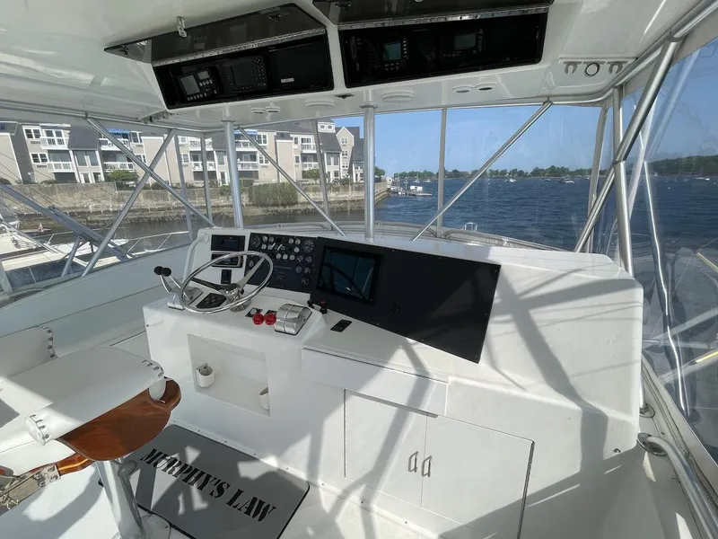Slide: The Image of 1997 Post 50 Convertible yacht helm with waterfront view and modern navigation equipment. - 34