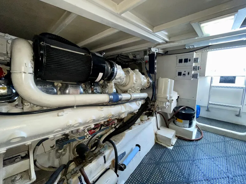 Slide: The Image of Engine room of a 1997 Post 50 Convertible yacht, showcasing machinery and equipment. - 39