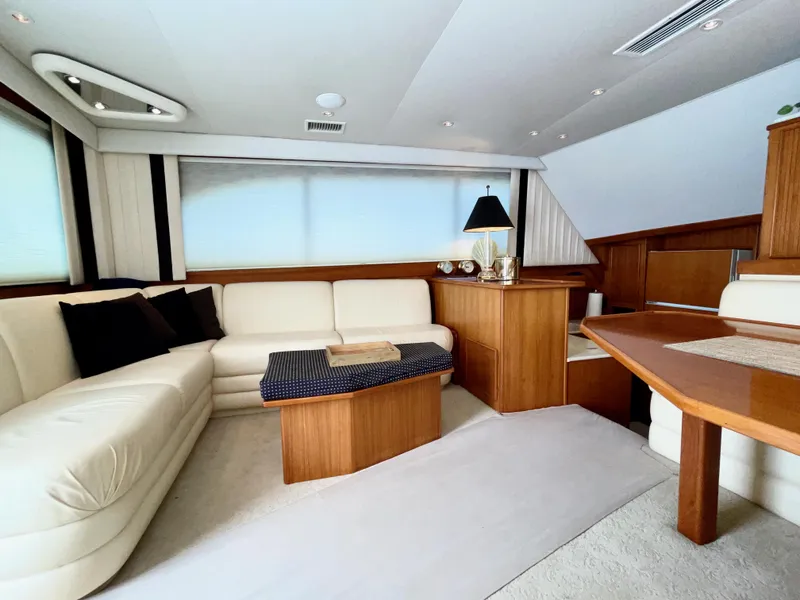 Slide: The Image of Luxurious interior of a 1997 Post 50 Convertible yacht with elegant wood and leather furnishings. - 4