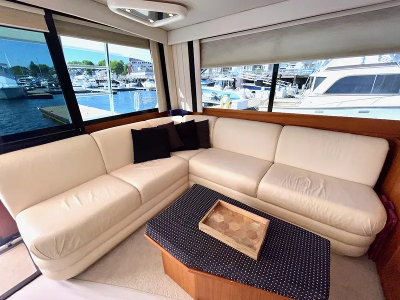 Slide: The Image of Luxurious interior of a 1997 Post 50 Convertible yacht with cream leather seating. - 6