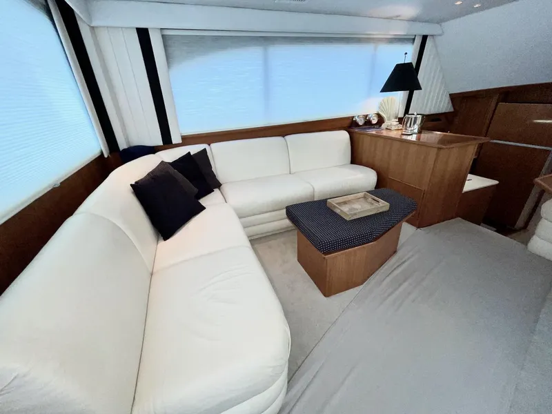 Slide: The Image of Luxurious interior of a 1997 Post 50 Convertible yacht with white leather seating. - 7