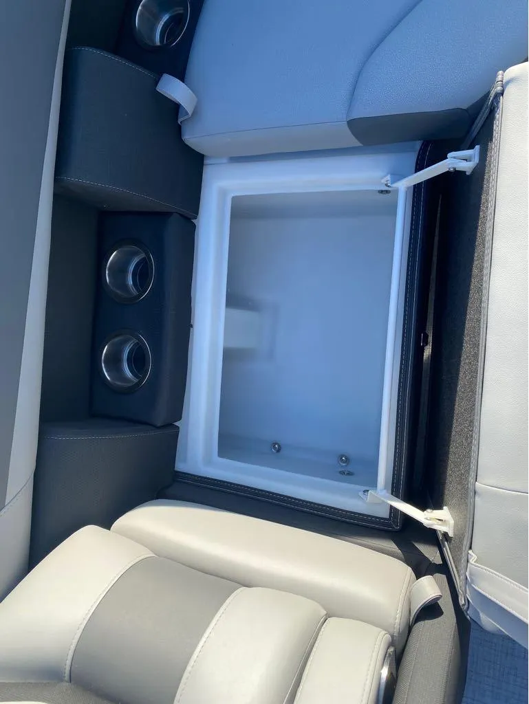 Slide: The Image of Interior of 2025 Trifecta C Series 24RFC boat with built-in storage compartment. - 12
