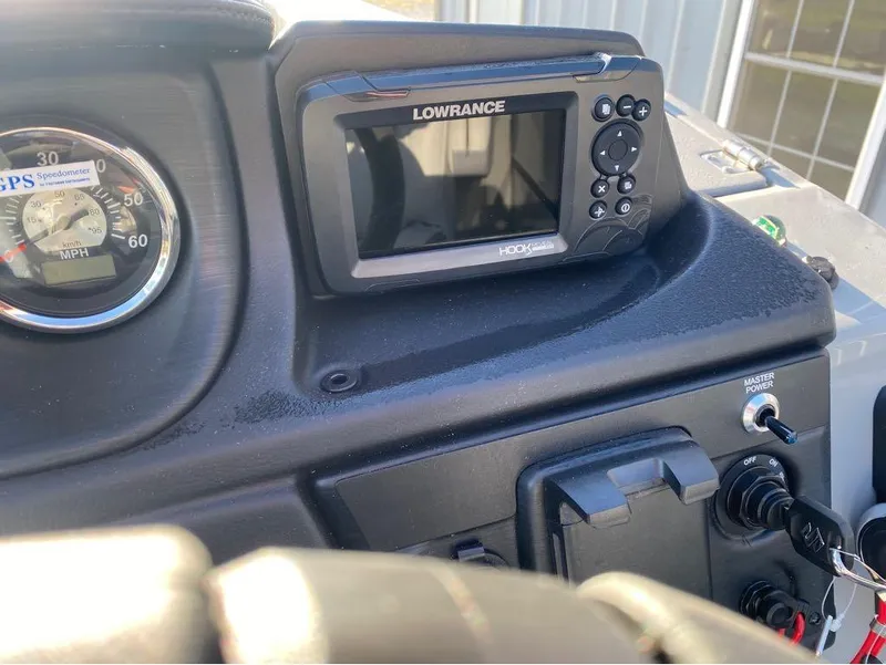 Slide: The Image of Dashboard of 2025 Trifecta C Series 24RFC with Lowrance GPS and speedometer. - 19