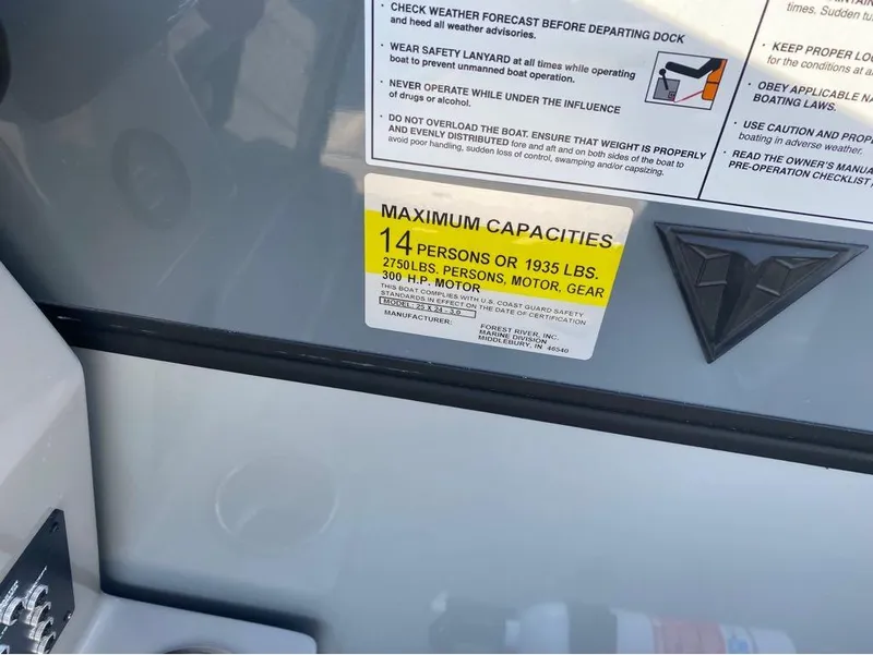 Slide: The Image of 2025 Trifecta C Series 24RFC capacity label, maximum 14 persons or 1935 lbs, 300 HP motor. - 21