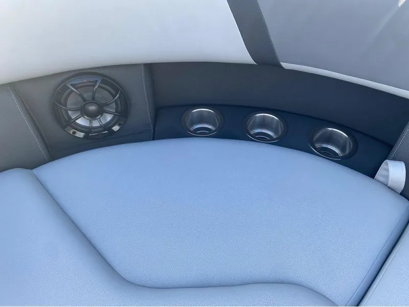 Slide: The Image of 2025 Trifecta C Series 24RFC boat interior with speaker and cup holders. - 5