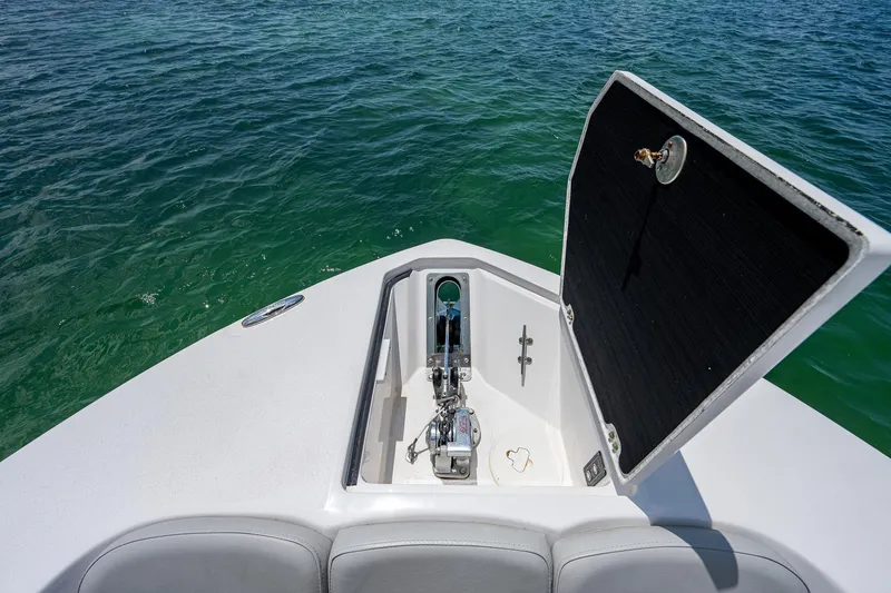 Slide: The Image of 2022 Sea Fox 288 Commander boat anchor compartment open on calm water. - 11