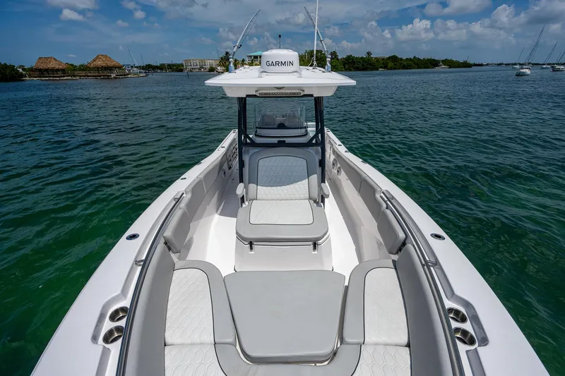 Slide: The Image of 2022 Sea Fox 288 Commander boat on water, featuring spacious seating and Garmin equipment. - 13
