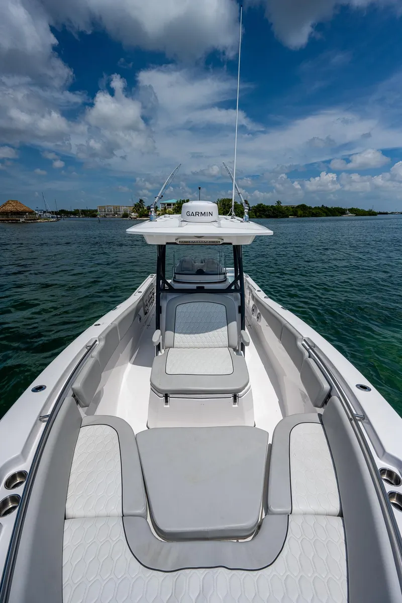 Slide: The Image of 2022 Sea Fox 288 Commander boat on water under blue sky. - 14