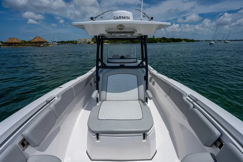 Slide: The Image of 2022 Sea Fox 288 Commander boat on water, featuring Garmin equipment and spacious seating. - 15