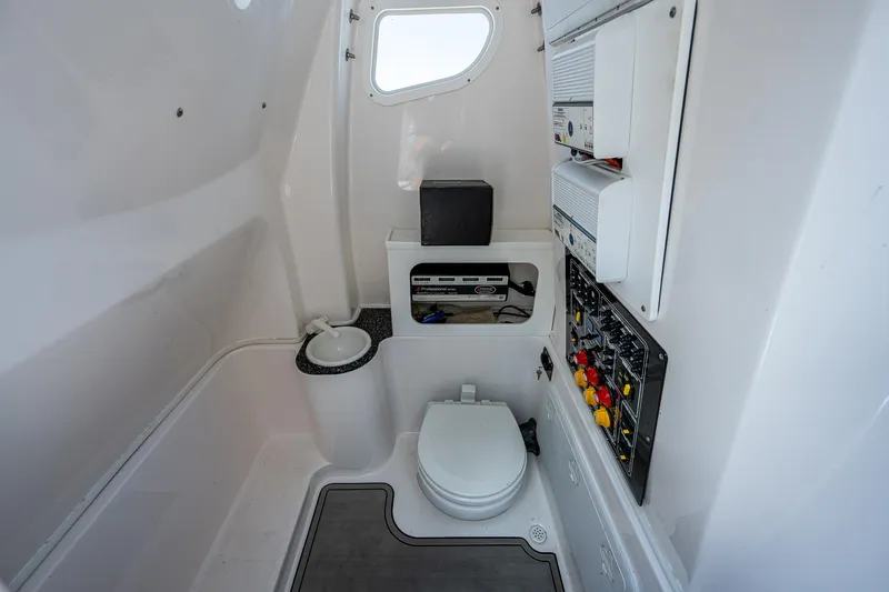 Slide: The Image of 2022 Sea Fox 288 Commander boat interior with toilet and control panel. - 18