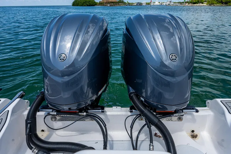 Slide: The Image of Twin outboard engines on a 2022 Sea Fox 288 Commander boat in open water. - 34