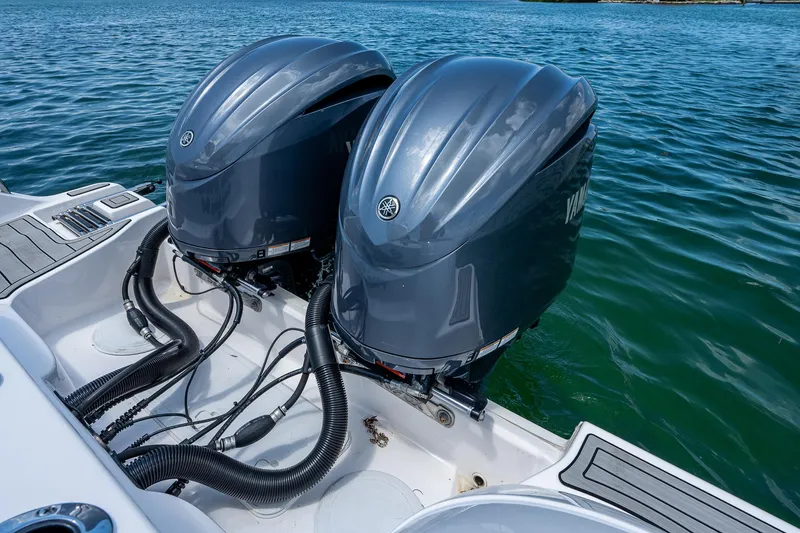 Slide: The Image of Twin outboard engines on a 2022 Sea Fox 288 Commander boat in clear blue water. - 35
