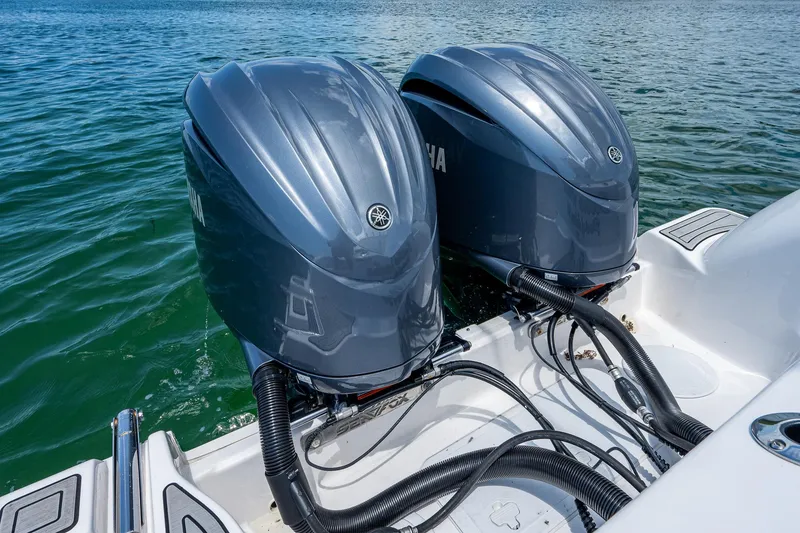 Slide: The Image of Twin Yamaha outboard engines on a 2022 Sea Fox 288 Commander boat in water. - 36