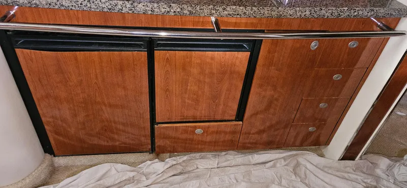 Slide: The Image of Wooden cabinetry and granite countertop in 2005 Sea Ray 360 Sundancer yacht interior. - 14