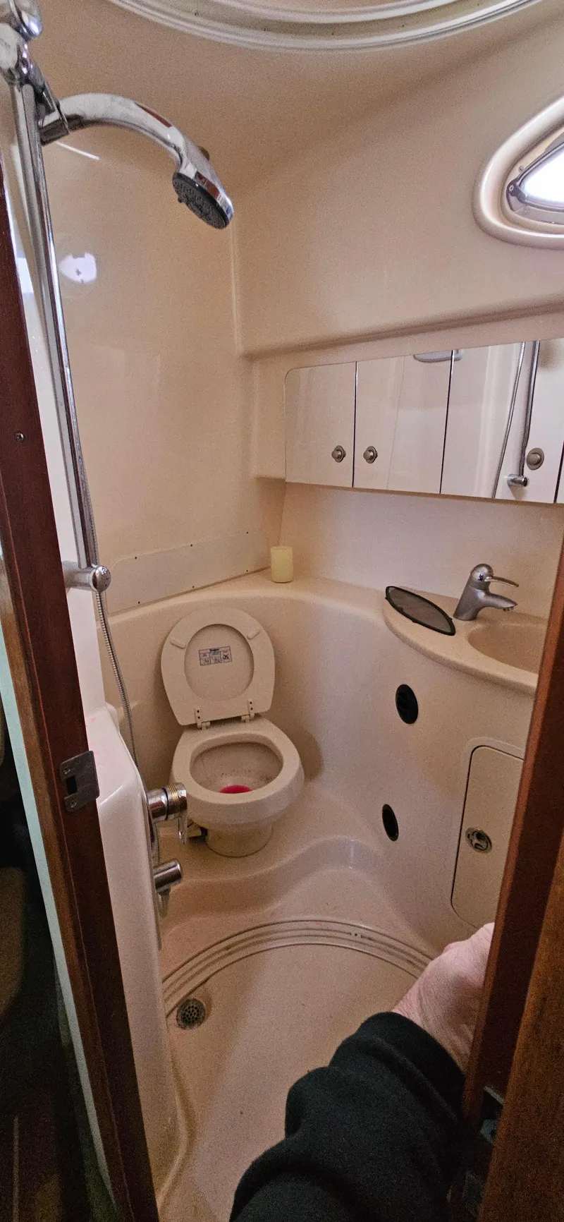 Slide: The Image of 2005 Sea Ray 360 Sundancer bathroom with shower, toilet, and sink. - 15