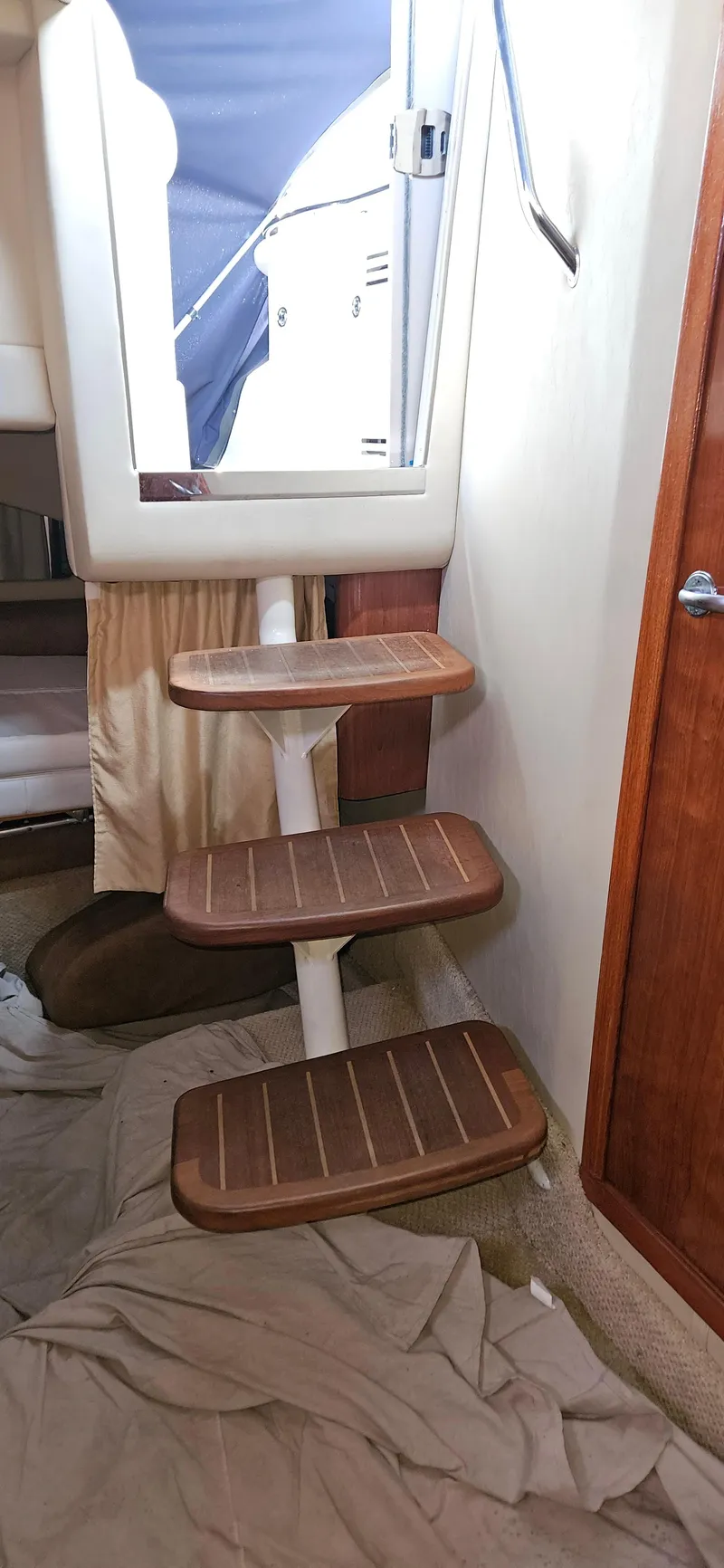 Slide: The Image of Interior stairs of a 2005 Sea Ray 360 Sundancer yacht, featuring wooden steps. - 19