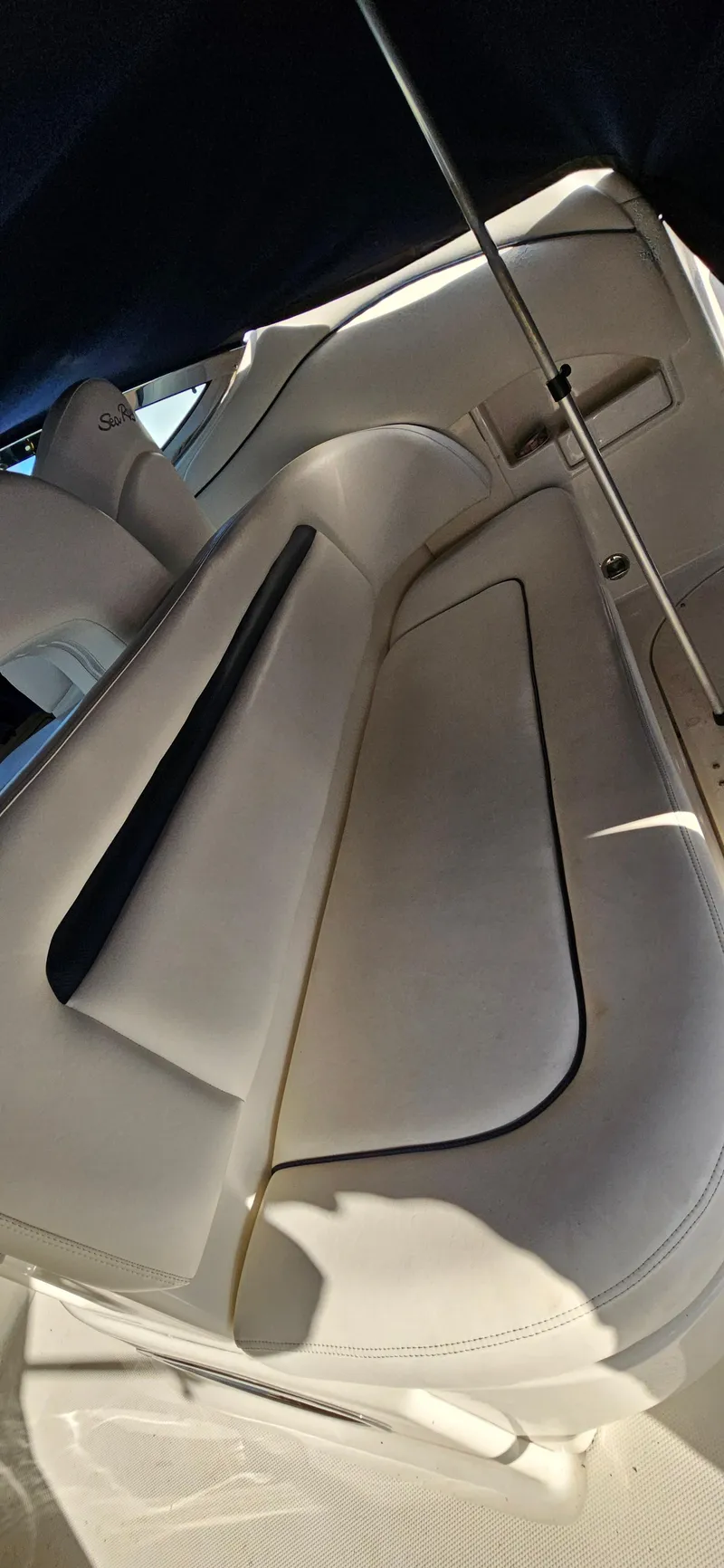 Slide: The Image of 2005 Sea Ray 360 Sundancer interior with white seating and sleek design. - 9