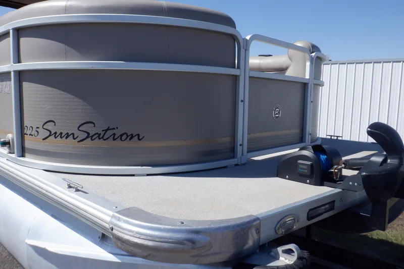 Slide: The Image of 2009 Premier 225 Sunsation LTD pontoon boat, side view, docked outdoors. - 10