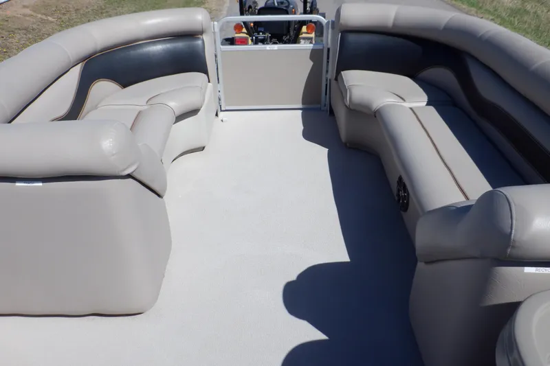 Slide: The Image of 2009 Premier 225 Sunsation LTD pontoon boat interior with beige seating and spacious layout. - 13