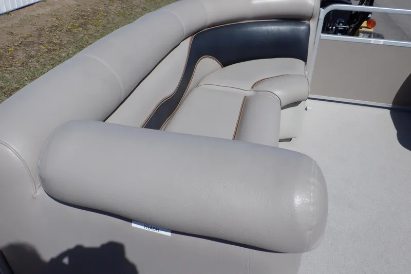 Slide: The Image of 2009 Premier 225 Sunsation LTD boat interior with beige and black seating. - 14