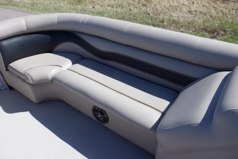 Slide: The Image of 2009 Premier 225 Sunsation LTD boat interior with cushioned seating and speaker. - 15