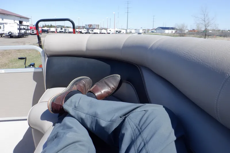 Slide: The Image of Man relaxing on a 2009 Premier 225 Sunsation LTD boat, feet up, sunny day. - 16