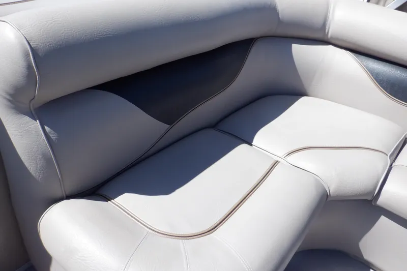 Slide: The Image of 2009 Premier 225 Sunsation LTD boat seating with gray upholstery and stylish design. - 23