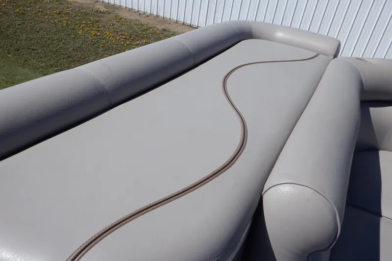 Slide: The Image of 2009 Premier 225 Sunsation LTD boat seating with beige upholstery and elegant stitching. - 24