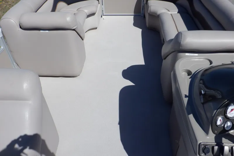 Slide: The Image of 2009 Premier 225 Sunsation LTD boat interior with gray seating and helm. - 27