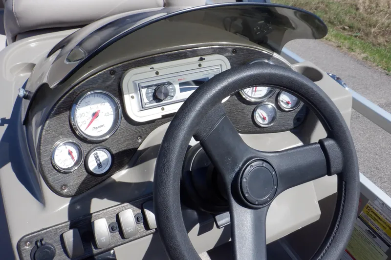 Slide: The Image of 2009 Premier 225 Sunsation LTD dashboard with steering wheel and gauges. - 29