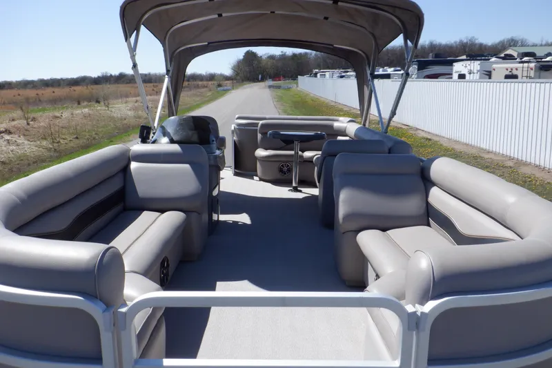 Slide: The Image of 2009 Premier 225 Sunsation LTD pontoon boat with spacious seating and canopy on a sunny day. - 3