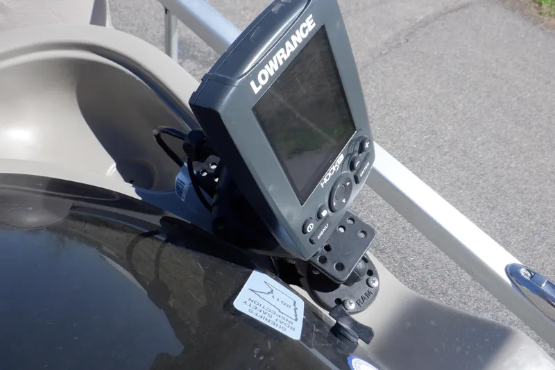 Slide: The Image of Lowrance fish finder mounted on 2009 Premier 225 Sunsation LTD boat dashboard. - 32