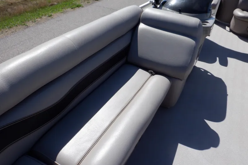Slide: The Image of 2009 Premier 225 Sunsation LTD boat interior with gray seating and black accents. - 33