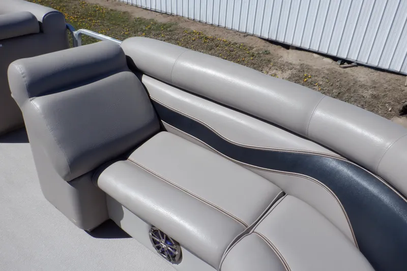 Slide: The Image of 2009 Premier 225 Sunsation LTD boat seating with gray upholstery and black accent. - 34