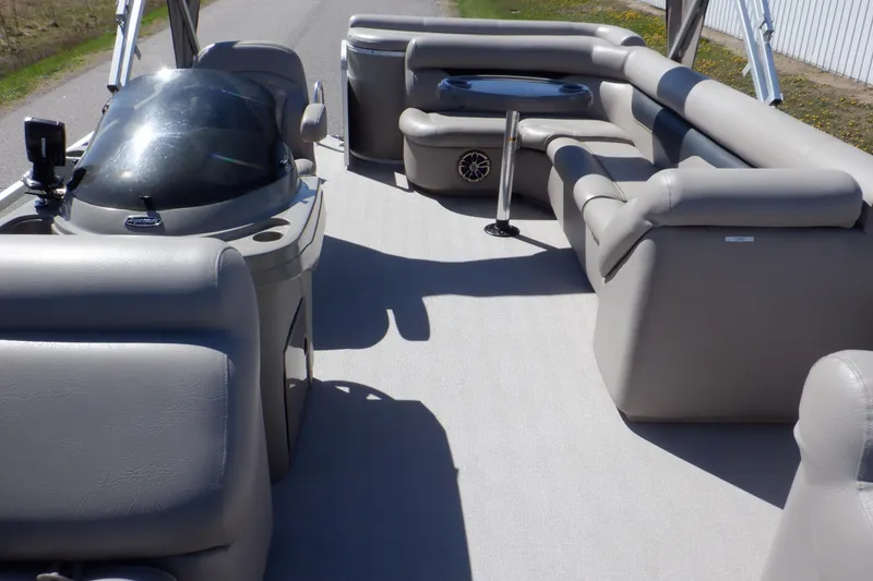 Slide: The Image of 2009 Premier 225 Sunsation LTD pontoon boat interior with plush seating and helm. - 35