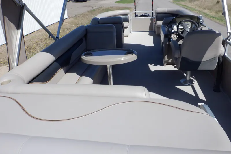 Slide: The Image of 2009 Premier 225 Sunsation LTD pontoon boat interior with seating and steering console. - 4