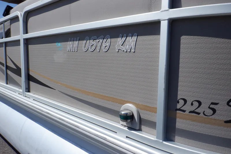 Slide: The Image of 2009 Premier 225 Sunsation LTD pontoon boat with registration number visible. - 47