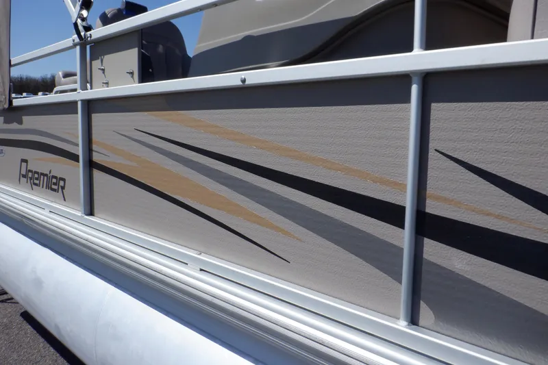 Slide: The Image of 2009 Premier 225 Sunsation LTD pontoon boat with sleek side graphics. - 48